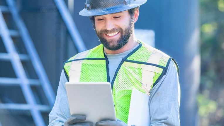 Inspector using public works software in the field