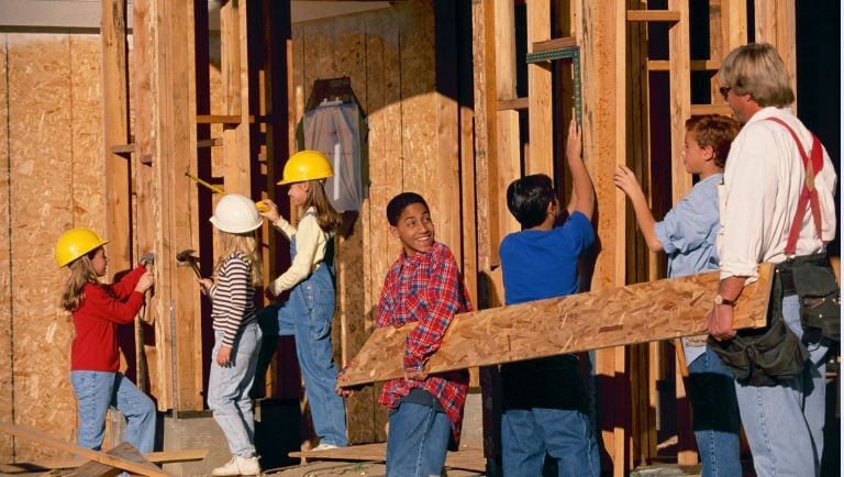 Kids participating in a building safety activity in their community