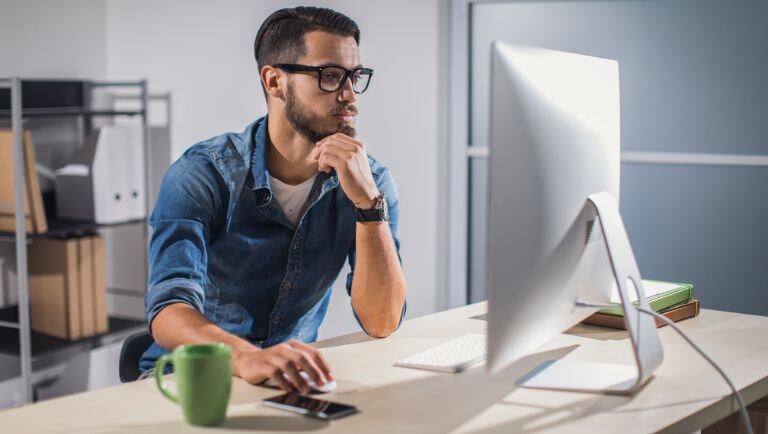 Plans reviewer working at computer